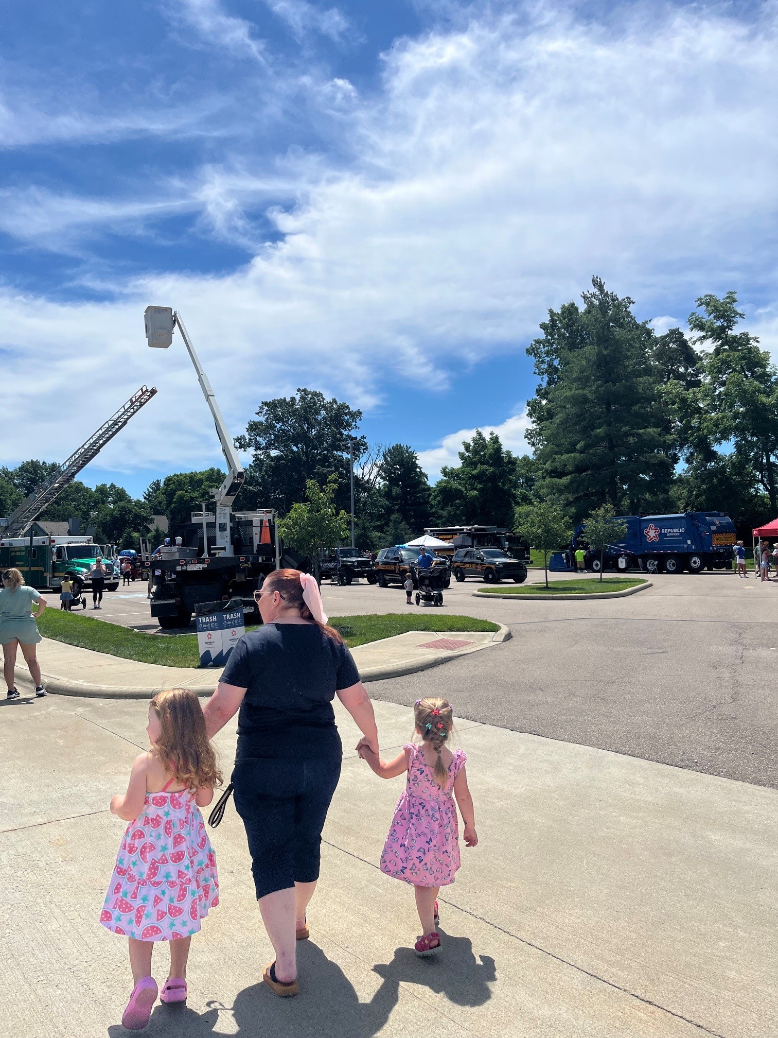 touch a truck people walking into touch a truck event